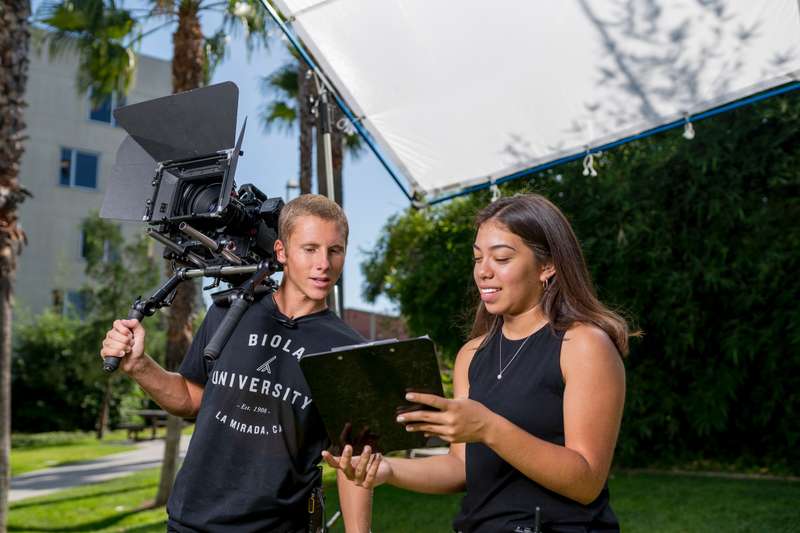 Students collaborate on a film set