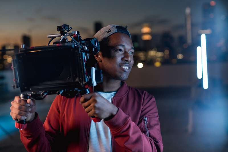 Student holding a cinema camera