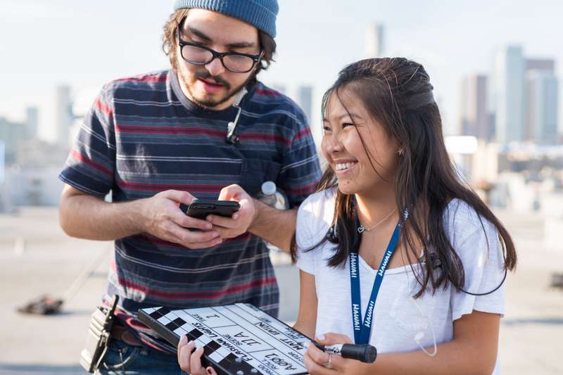 Students collaborate on a film set