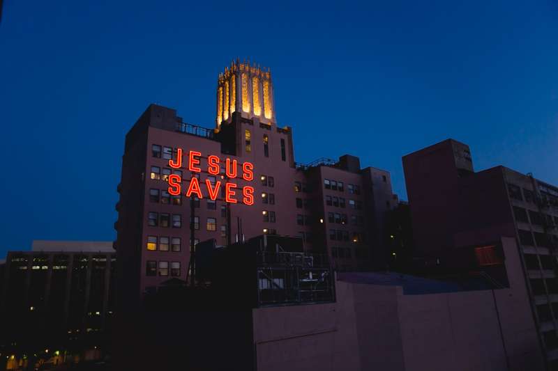 The 'Jesus Saves' neon sign atop the Ace Hotel.