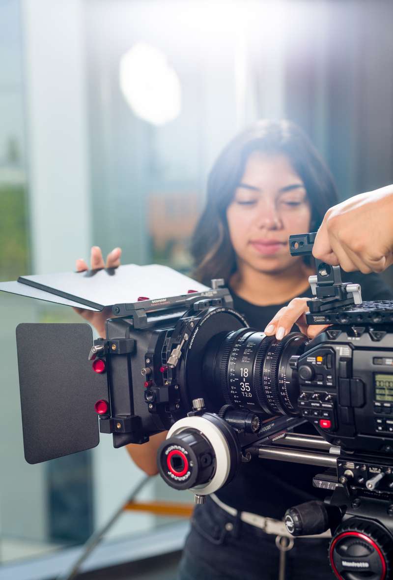 Student adjusts a lens